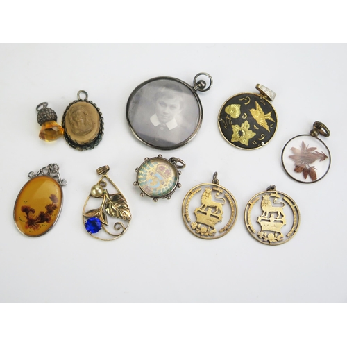 304 - Ten Pendants including a silver and enamel 3d