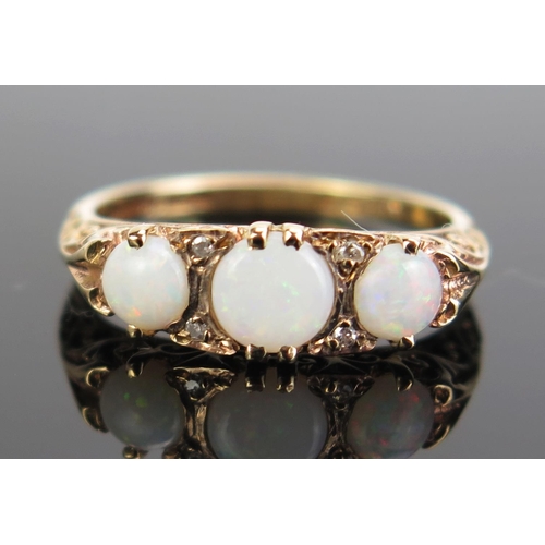 313 - A 9ct Gold, Opal and Diamond Ring, hallmarked, size K.5, c. 2.09g