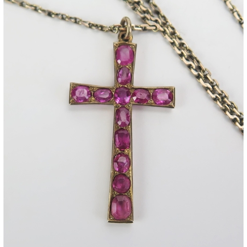 318 - A Cross Pendant Set with rubies and in a yellow metal setting, c. 35mm drop and KEE tested as 14ct a... 