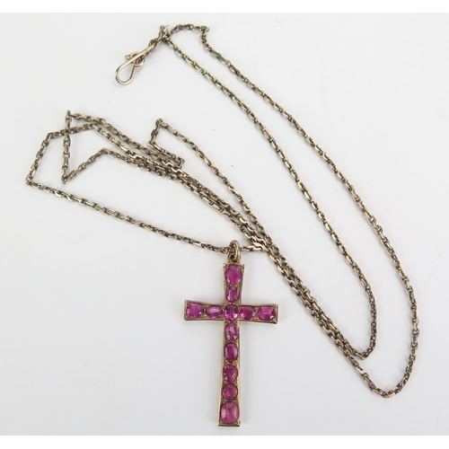 318 - A Cross Pendant Set with rubies and in a yellow metal setting, c. 35mm drop and KEE tested as 14ct a... 