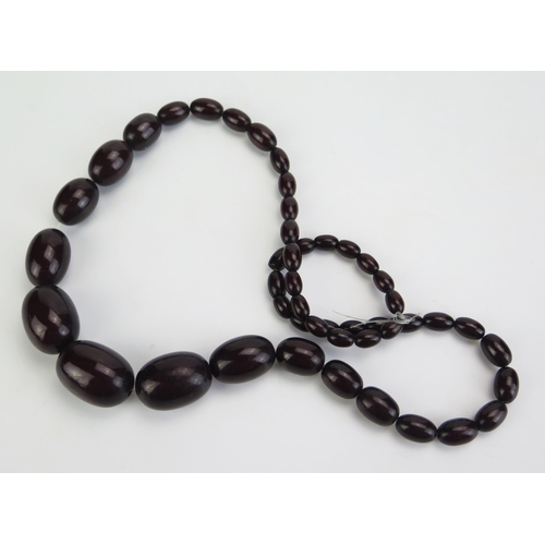 319 - A Faux Cherry Amber Graduated Bead Necklace, c 26