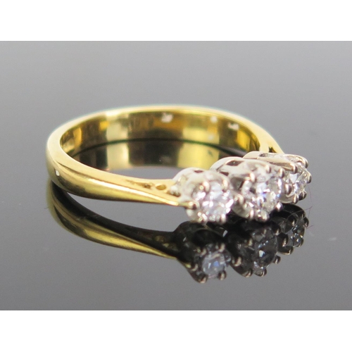 328 - An 18ct Gold and Diamond Three Stone Ring, c. 39mm principal stone, size J.5, c. 3.35g