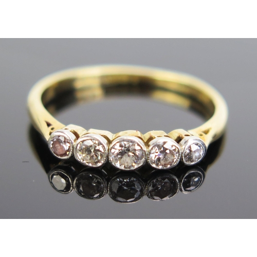 333 - A Diamond Five Stone Ring in an 18ct gold and platinum rub over setting, c. 31mm principal stone, si... 