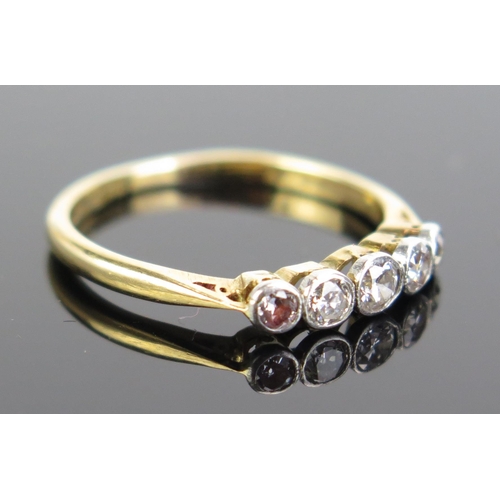 333 - A Diamond Five Stone Ring in an 18ct gold and platinum rub over setting, c. 31mm principal stone, si... 