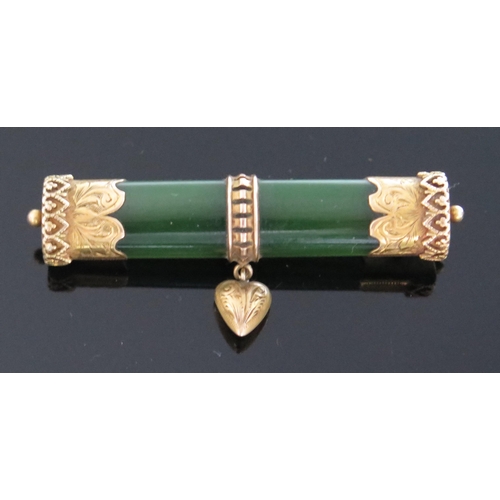 334 - An Antique Nephrite Brooch decorated with a suspended heart with precious yellow metal mounts, KEE t... 