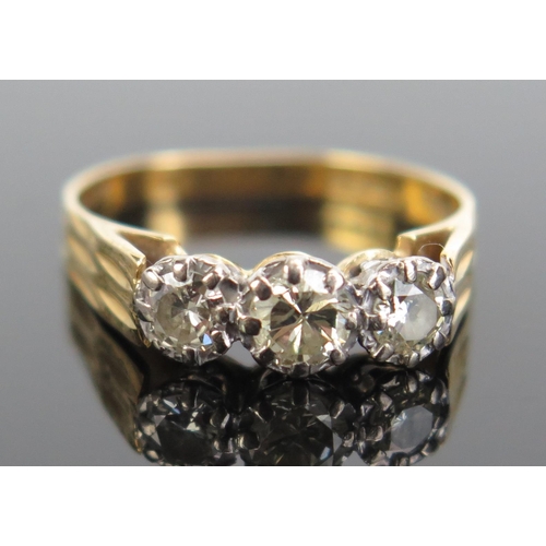 337 - An 18ct Gold and Diamond Three Stone Ring, c. 4.2mm principal stone, size O, c.3.42g