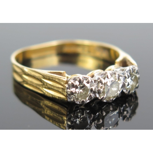 337 - An 18ct Gold and Diamond Three Stone Ring, c. 4.2mm principal stone, size O, c.3.42g