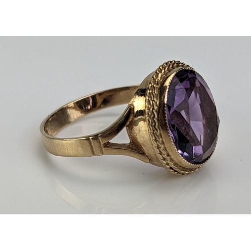 34 - A 9ct Gold and Amethyst Dress Ring, c. 11.5x10mm stone, hallmarked, size L.75, c. 3.81g