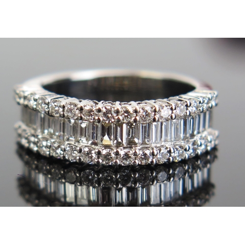 340 - An 18K White Gold and Diamond Half Eternity Ring with channel set baguette cuts and round cuts, size... 