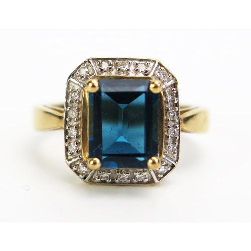 356 - A 9ct Gold, Blue Topaz and Diamond Dress Ring, 13x12mm head, size N, c. 4.16g