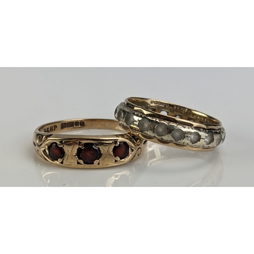 44 - A 9ct Gold and Garnet Three Stone Ring (size N.25, c. 2.41g) and a 9ct gold and CZ eternity ring (si... 