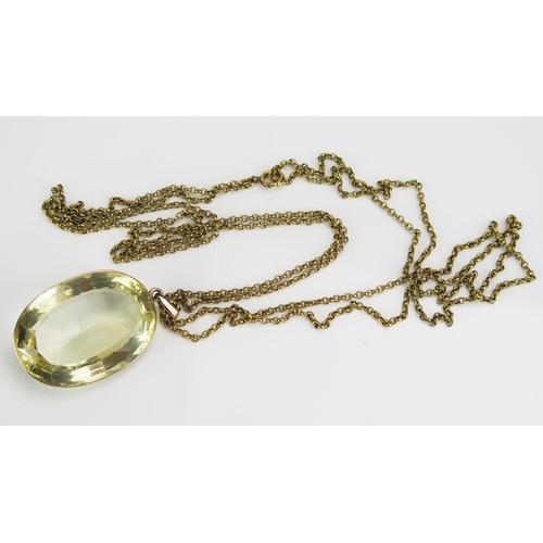 62 - A Large Citrine Pendant in a precious yellow metal surround and on a gilt belcher chain, c. 41x29mm ... 