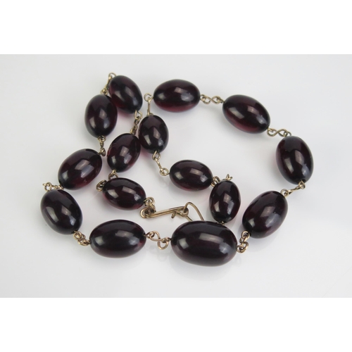 78 - A Faux Cherry Amber Bead Necklace, 17