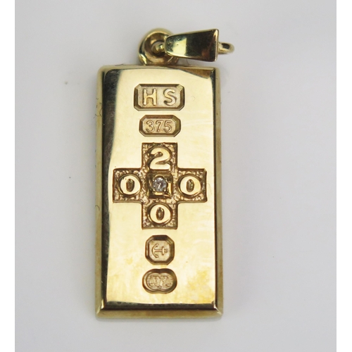 86 - A 9ct Gold Millennium Pendant Ingot set with a single diamond (boxed, limited edition 1/4oz stated b... 