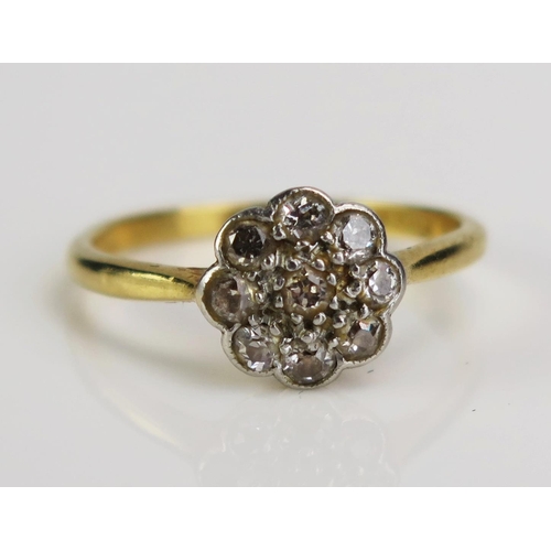 97 - An 18ct Gold and Diamond Cluster Ring, 9mm wide head, size M.5, 2.72g