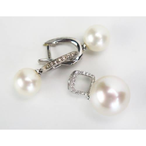 135 - A 9ct White Gold, untested Pearl and Diamond Pendant with matching earrings, pendant with c, 13mm pe... 