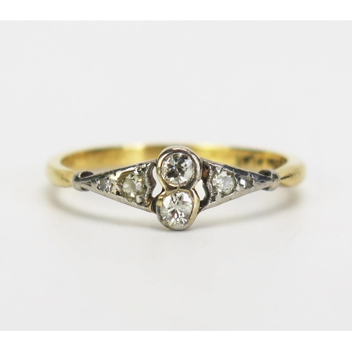 157 - A Diamond Ring in an 18ct gold and platinum rub over setting, size N.5, 2.29g