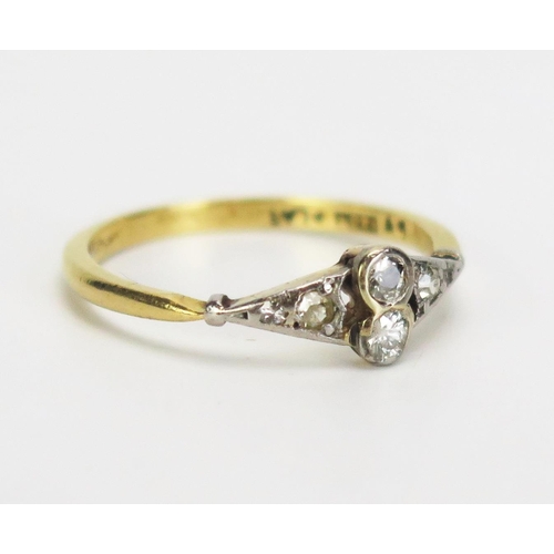 157 - A Diamond Ring in an 18ct gold and platinum rub over setting, size N.5, 2.29g