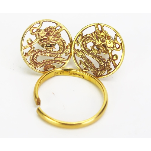 280 - A Cut 22ct Gold Wedding Band (c. 2.03g) and a pair of yellow metal Chinese dragon cufflinks