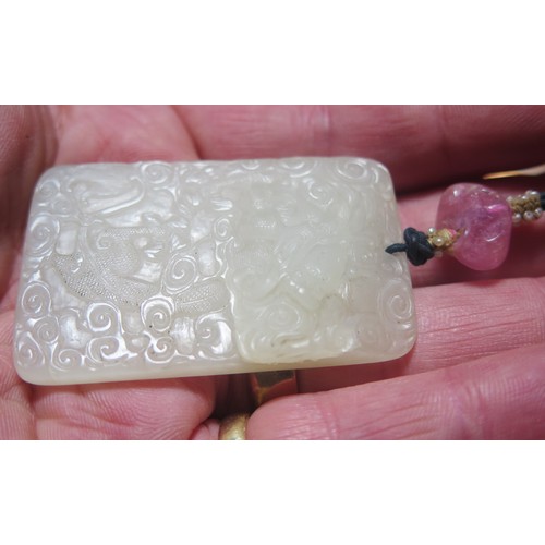 1188 - A Fine Chinese Carved White Jade Yupei Jinbu Pendant decorated with a fantail goldfish? amidst swirl... 