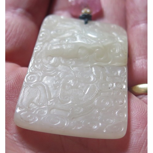 1188 - A Fine Chinese Carved White Jade Yupei Jinbu Pendant decorated with a fantail goldfish? amidst swirl... 