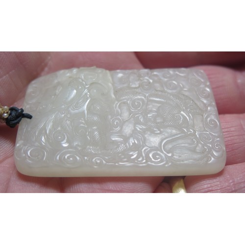 1188 - A Fine Chinese Carved White Jade Yupei Jinbu Pendant decorated with a fantail goldfish? amidst swirl... 