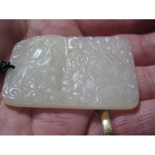 1188 - A Fine Chinese Carved White Jade Yupei Jinbu Pendant decorated with a fantail goldfish? amidst swirl... 