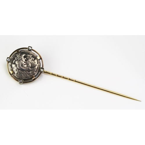 101 - An Unmarked Precious Yellow Metal, Rose Cut Diamond Stick Pin set with a Greek? silver coin, 6.52g