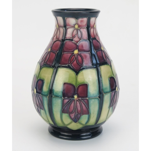 1012 - A Moorcroft pottery vase with 'Violet' decoration, by Rachel Bishop, 13.5cm high.