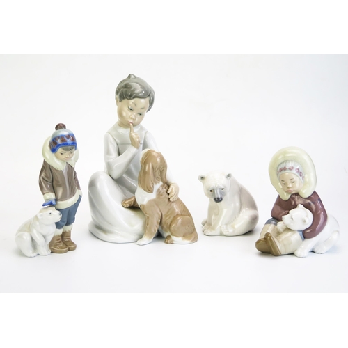 1016 - Four assorted Lladro porcelain figures, including Polar Bear, boy with puppy, Eskimo with polar bear... 