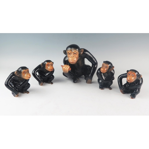 1017 - A set of five Sylvac pottery chimpanzees, all seated. 17cm and 10cm high. (5).