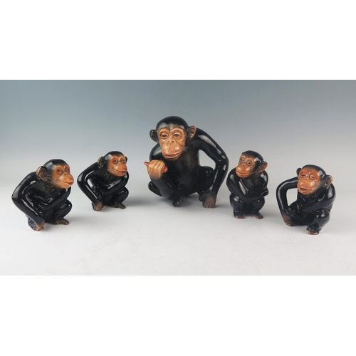 1017 - A set of five Sylvac pottery chimpanzees, all seated. 17cm and 10cm high. (5).