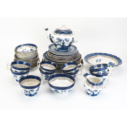 1019 - A collection of 'Ye Old Chinese Willow' pattern tea and dinner wares, including tea pot, junket set,... 