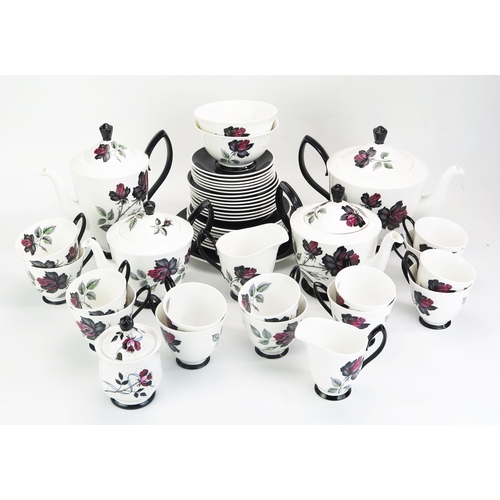 1023 - A Royal Albert 'Masquerade' pattern part tea and coffee service, includes, tea pots, coffee pot, cre... 