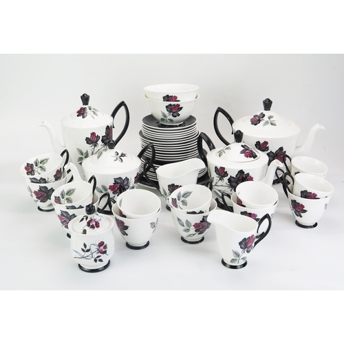 1023 - A Royal Albert 'Masquerade' pattern part tea and coffee service, includes, tea pots, coffee pot, cre... 