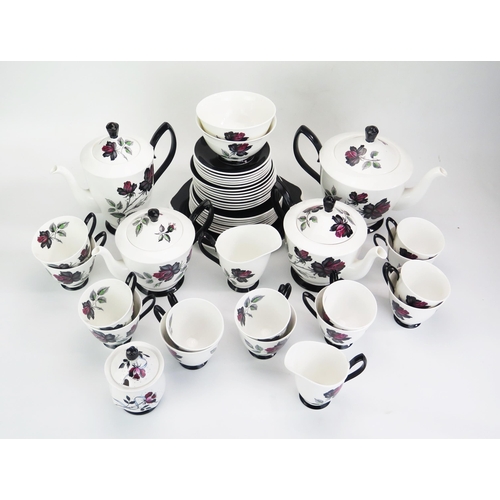 1023 - A Royal Albert 'Masquerade' pattern part tea and coffee service, includes, tea pots, coffee pot, cre... 