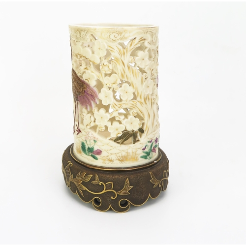 1025 - A rare Royal Worcester porcelain tusk vase in the Japanese taste, with pierced ivory ground having p... 