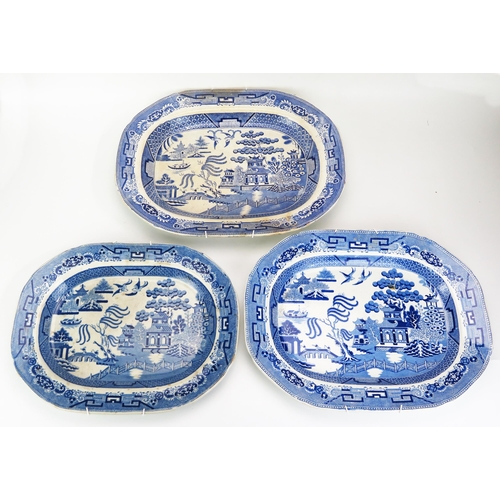 1026 - A group of three Staffordshire blue and white 'Willow' pattern meat plates, 39cm, 42cm and 46cm wide... 