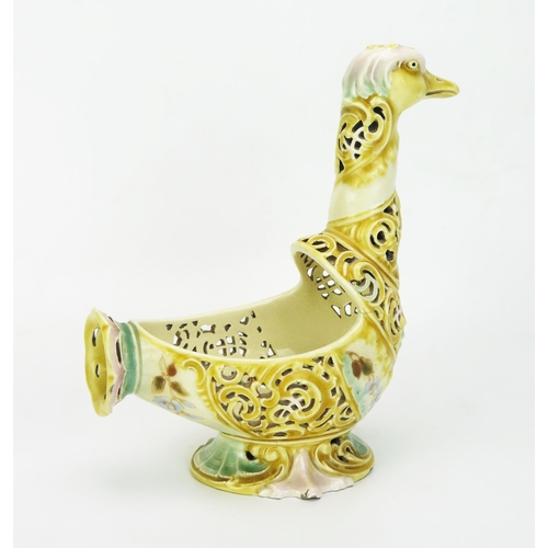 1028 - A Zsolnay Pecs pottery model of a bird, with pierced spiral decoration to the neck and body with pai... 