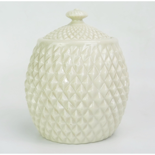 1041 - A Belleek porcelain biscuit barrel and cover, of pineapple design, with brown under-glaze mark 18cm ... 