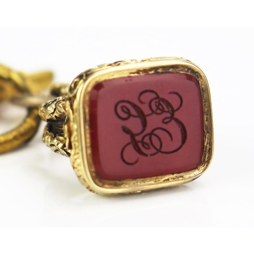 105 - A 19th Century Gilt Metal and Carnelian Seal on a gilt jump ring with two watch keys