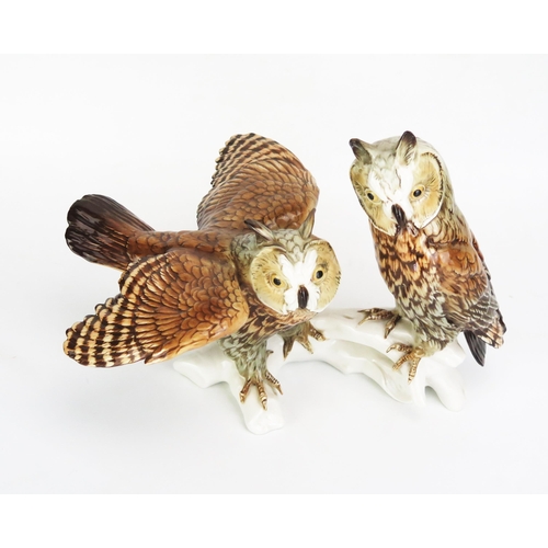 1051 - A Karl Ens Volkstedt Porcelain Group Modelled as a pair of long eared owls, 26cm tall