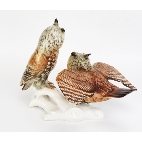 1051 - A Karl Ens Volkstedt Porcelain Group Modelled as a pair of long eared owls, 26cm tall