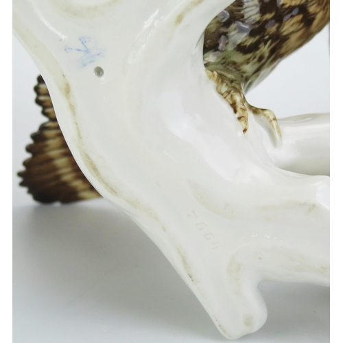 1051 - A Karl Ens Volkstedt Porcelain Group Modelled as a pair of long eared owls, 26cm tall