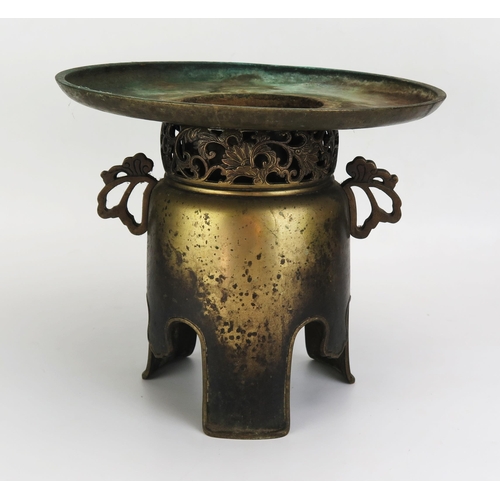 1065 - An Antique Chinese Bronze Spittoon of two parts, the base with a pierced floral scroll neck and pier... 