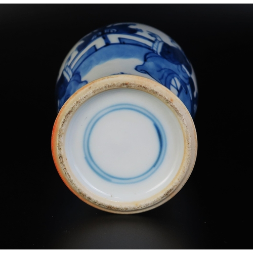 1066 - A Chinese blue and white porcelain vase of baluster form, decorated with seated figures in a garden ... 