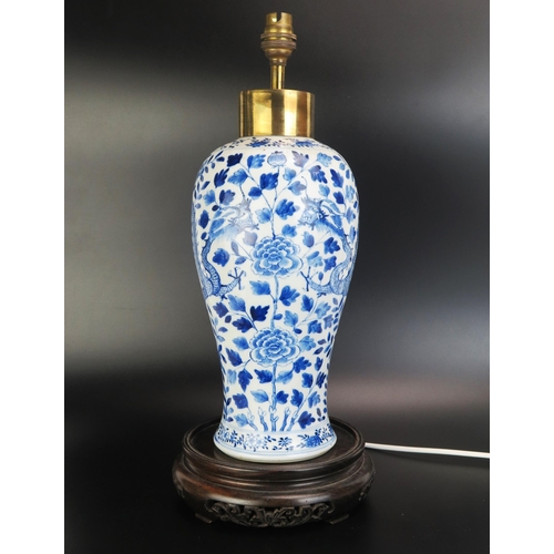 1072 - An Antique Chinese blue and white vase of 40cm. ovoid form decorated with dragons among flowering sh... 