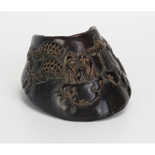 1075 - A Chinese carved horse's hoof decorated with figures in a pagoda landscape, bears six character mark... 