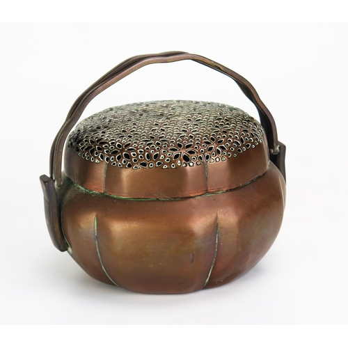 1078 - A Chinese copper charcoal burner, of circular lobed form with pierced lift off lid with swing handle... 