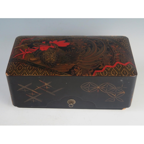 1087 - A Japanese lacquered tebako, of rectangular outline, the lift-off lid decorated with a strutting coc... 